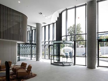 The building features a Diamond Series revolving door and DFA 127 automatic swing door operator at the main entrance 