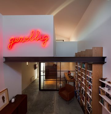 Passive Warehouse library and gezellig neon signage. Photography by Trevor Mein