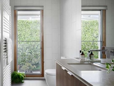 The refurbished bathroom features BINQ windows