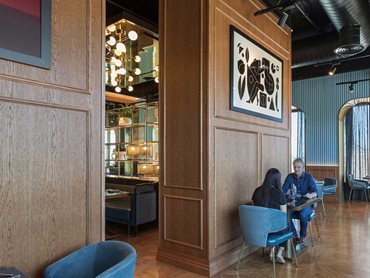 Garcon Bleu's 4m high walls are finished in full height custom stained oak veneer