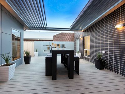 Modern outdoor patio with retractable louvre sunshade system