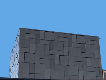 The feature facade was created using Dri-Design flat and tapered cassettes in a horizontal and vertical staggered layout