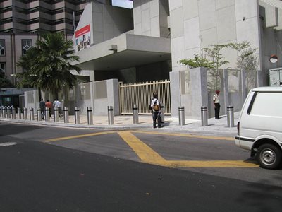 Street view of mounted bollards in front building exterior