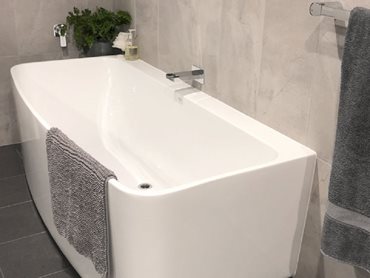 A back-to-wall bath from the Caroma Urbane range is the hero piece in the bathroom