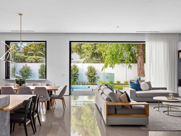 Six-metre-wide Artisan bi-fold doors connect indoor and outdoor living areas