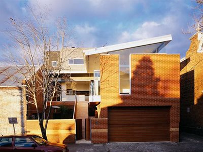 Residential home with red brick cladding