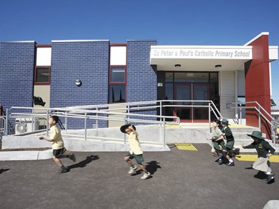 primary school facade navy glazed bricks children running