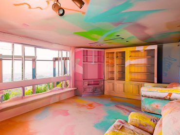 The house was painted over in a riot of colours to create a kaleidoscopic art installation