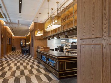 Garcon Bleu is modelled on a 19th century Parisian brasserie, with timber panelling, mosaic tiling and salon hung art