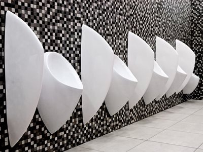 Uridan waterless urinal with privacy screen