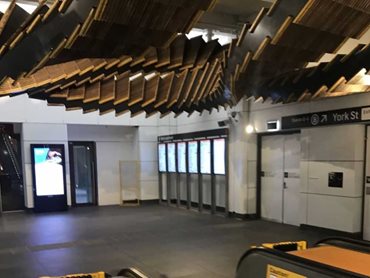 Parts of the original escalators were repurposed into a ceiling-mounted artwork titled 'Interloop