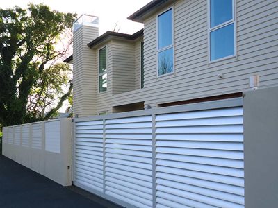 External View of White Louvre Boundary Wall Fence on House Exterior