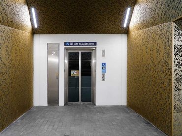Como Station: Gold-coloured anodised aluminium perforated underpass