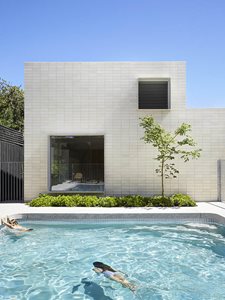cream bricks residential swimming pool home