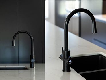 HydroTap’s beautiful matte black finish stands out against the white marble island benchtop