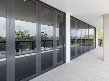 A magnificent and aesthetic window-and-door system floods the building with natural light