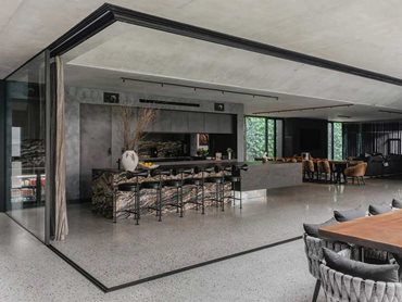 The seamless blend of off-form architectural concrete and polished concrete floors creates a sense of sophistication and elegance