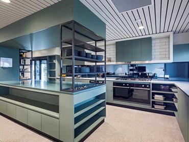 The commercial kitchen features Maxton Fox joinery 