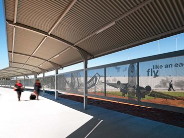 The cantilevered walkway facilitates patron transfer between the long-term car park and the terminal building 