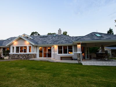 Exterior view of residential home with grey concrete roof tiles