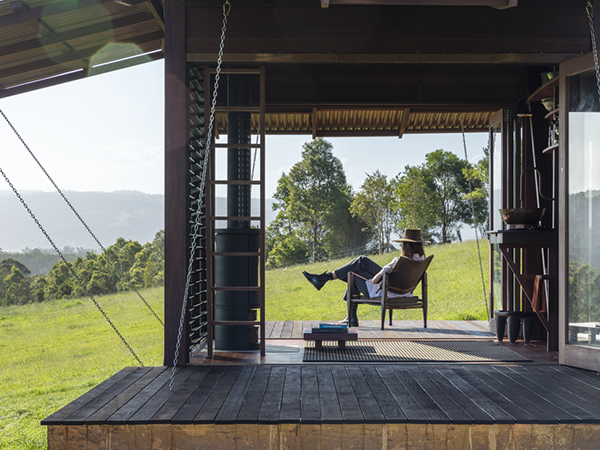 Overlooking the Pacific Ocean amongst the lust green paddocks of Berry, sit two tiny copper towers. Designed to provide the essential requirements for shelter – a bed, a deck, a fireplace, and a bathroom.