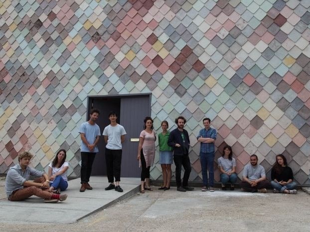 The Assemble team infront of their Famous Yardhouse studio project which features handmade colourful tiles. Image: Assemble
