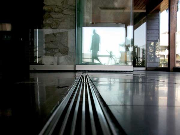 Linear drainage systems add a striking visual statement to any setting

