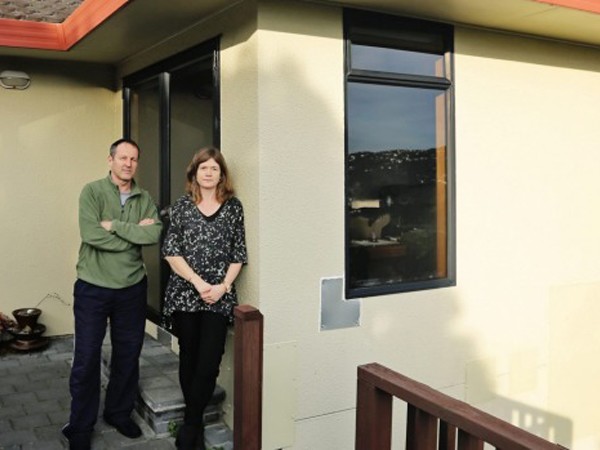 Tracey Cridge and Mark Unwin outside their leaky Wellington home which they believe is due to the use of HardieTex. Image: Stuff.co.nz