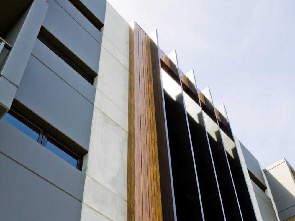 Stryüm range of woodgrain finish aluminium facade panels 
