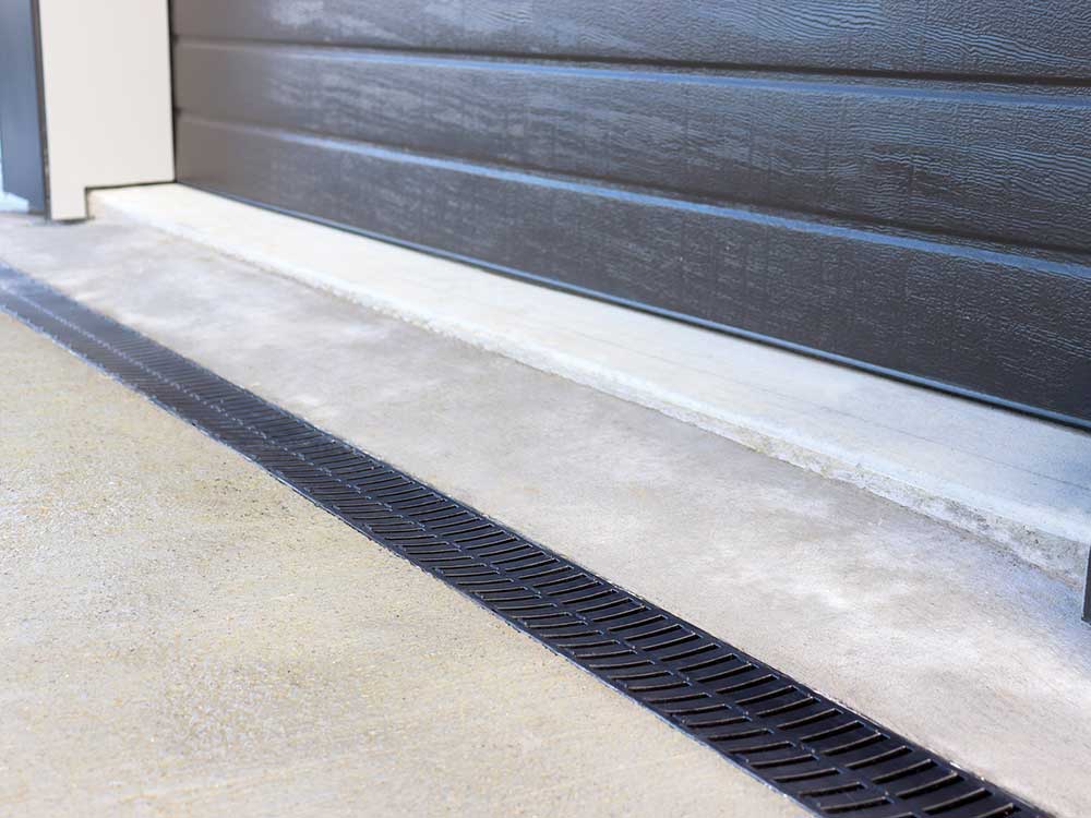 Driveway drainage can be installed at the garage entrance