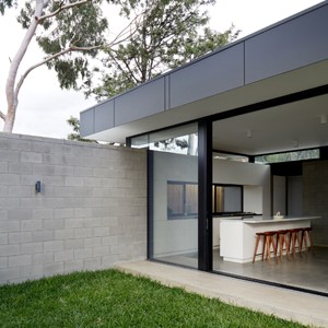 DKO Architecture plugs contemporary glazed box into back of subdued art deco bungalow