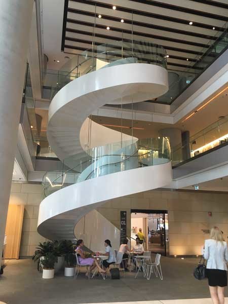 The curved glass stair at the Barangaroo tower
