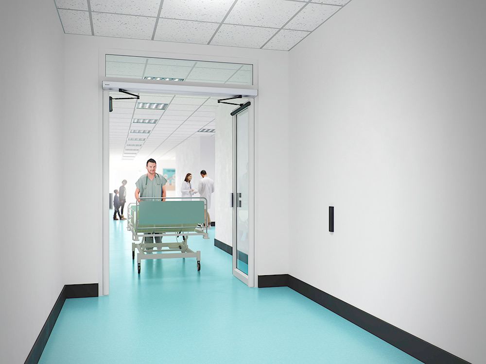 Hospital corridor interior with automatic swing door