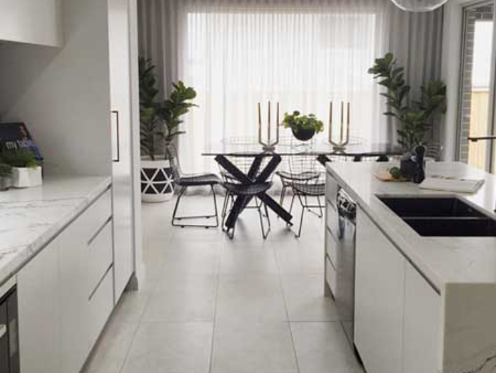 The display home kitchen featuring Statuario Venato