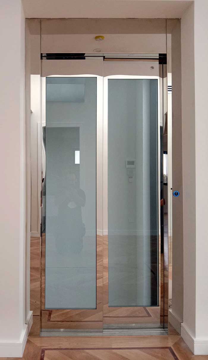 Glass door elevator