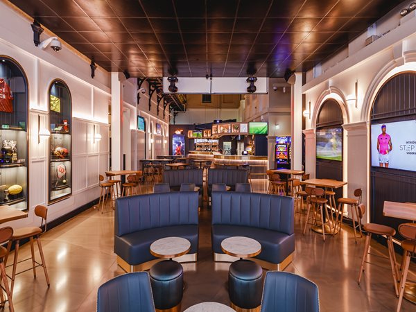 Sports bar with plush blue couches