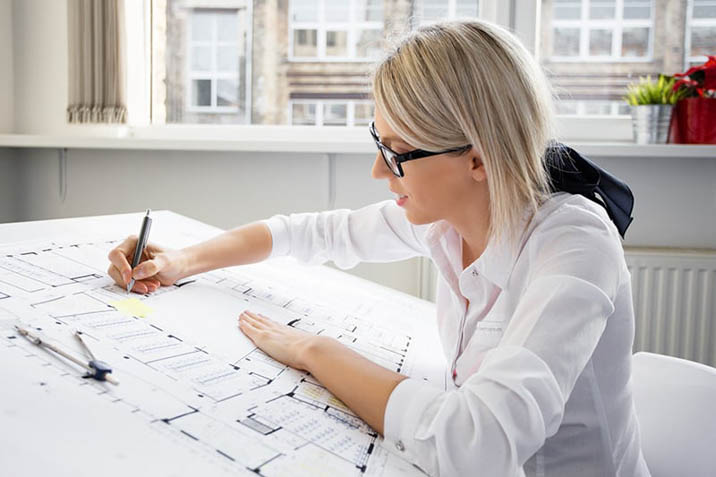architect working drawing plans glasses floor plans construction concept sketches draftsman
