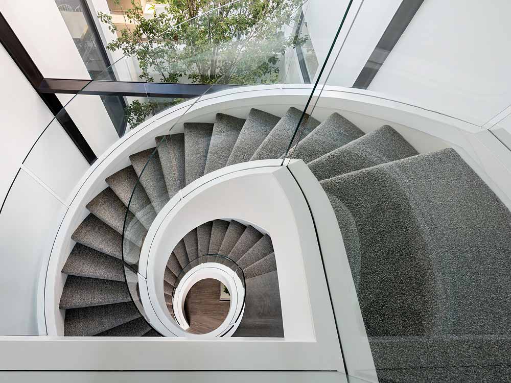 Frameless glass balustrade on spiral stairs