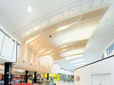 The stunning curved linear batten feature ceiling at Rhodes Waterside foodcourt