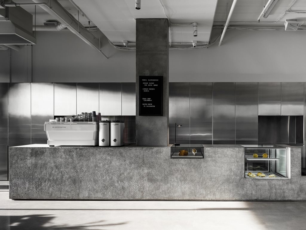 Concrete, perforated aluminium and terrazzo star in Melbourne café fitout