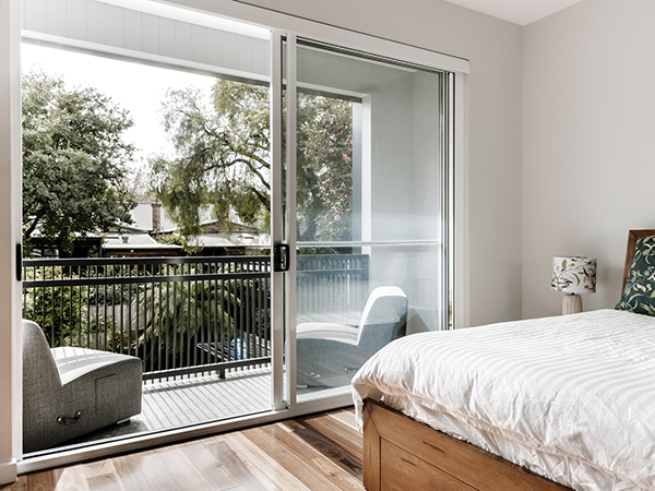A new master bedroom to the rear is provided with a balcony to take advantage of a borrowed landscape, while providing privacy screening to, and from neighbouring properties.