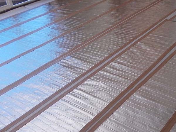 Under carpet floor heating system
