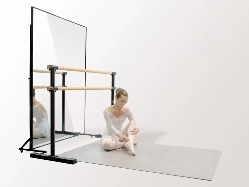 Home dance studio with dance floor, ballet barre, and mirror