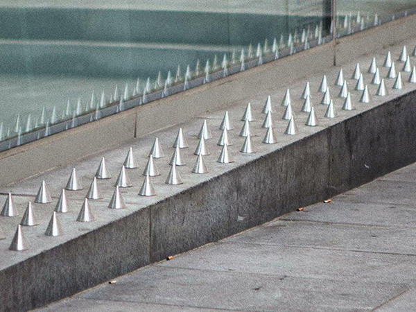 While some of it seems pretty benign – like those metal spikes inside awnings to deter birds from perching and pooing all over the place, other examples seem very hostile indeed, like metal spikes on the ground under enclosed areas to deter homeless people from sleeping there.