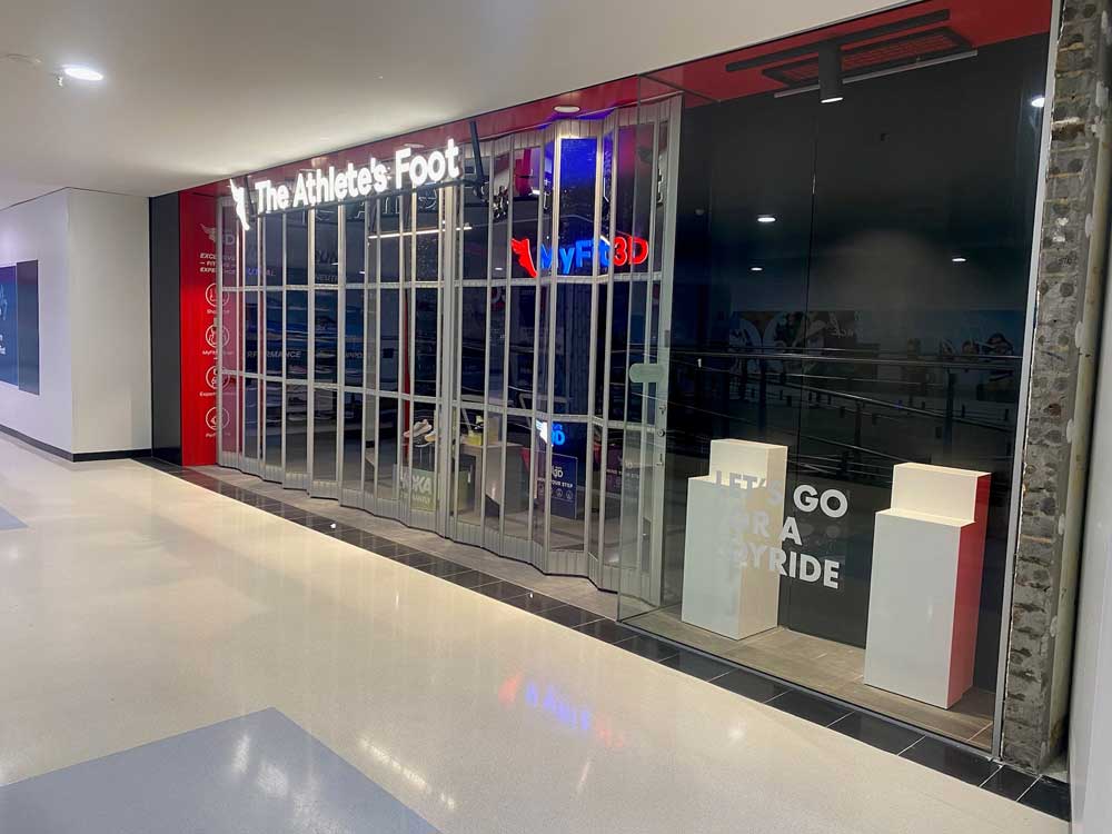 ATDC's FC1 commercial sliding door secures the Athlete’s Foot store