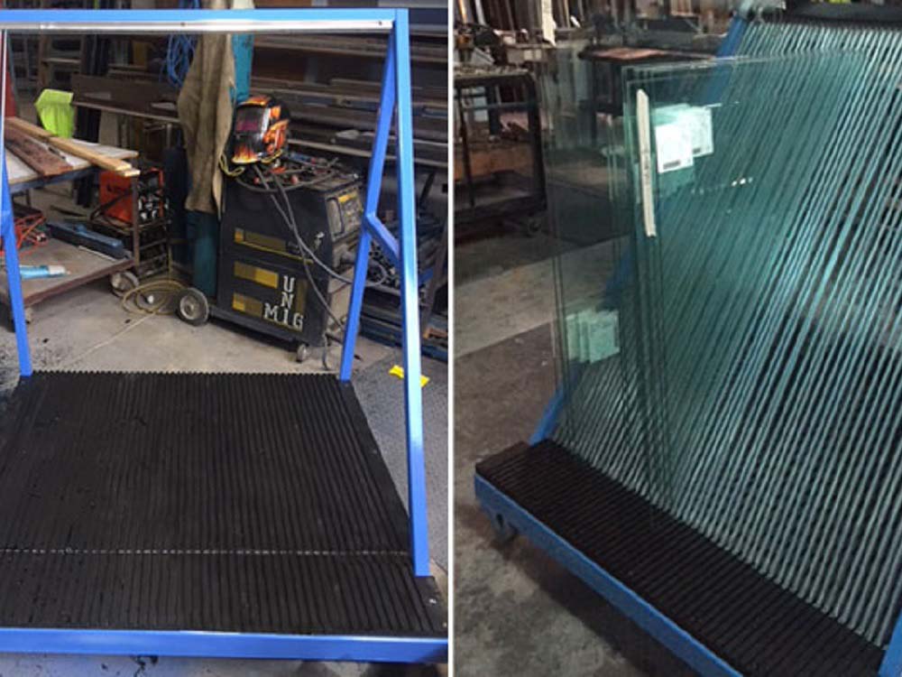 Black HDPE panels with CNC routed grooves for safe glass handling