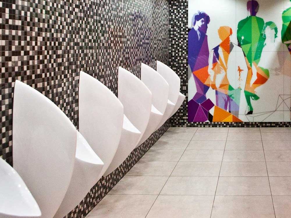 Uridan waterless urinals with privacy screens