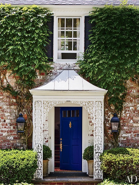 Bright blue front door to welcome guests