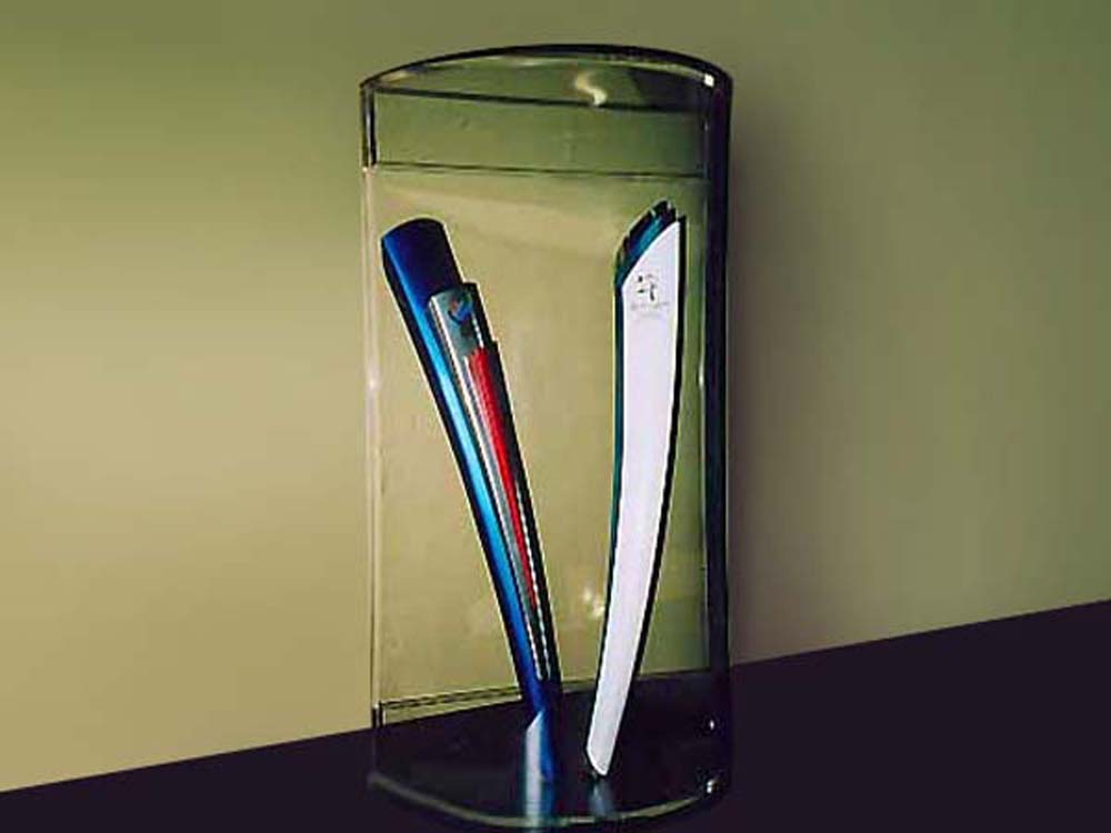 Clear acrylic cabinet displaying the torches