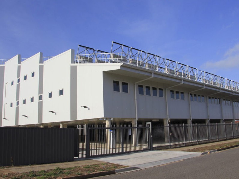 A four-storey office building powered by a combination of thermal and PV solar and wind energy in South Australia has cut its connection to the electricity grid in what its owners claim to be a world first. Image: Supplied
